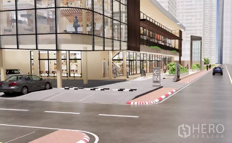 Retail Space for rent in Khlong Toei, Bangkok - Vehicle entrance and shared parking access beside the glass-front mall.