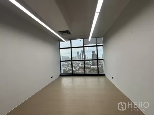 Office Space for rent in Watthana, Bangkok - Private office with large picture window overlooking the Bangkok skyline.