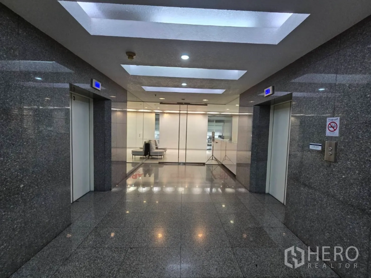 Office Space for rent in Watthana, Bangkok - Granite elevator lobby with bright ceilings outside the office floor.