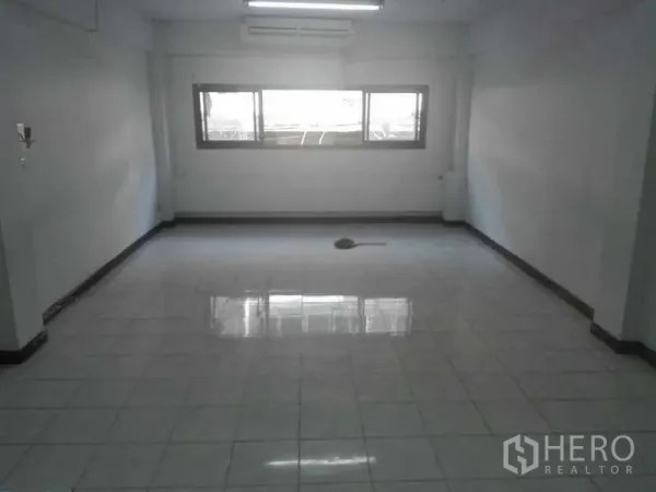 Home Office for rent or sale in Bang Na, Bangkok - Upper-floor office room with white tiles, AC and horizontal windows.