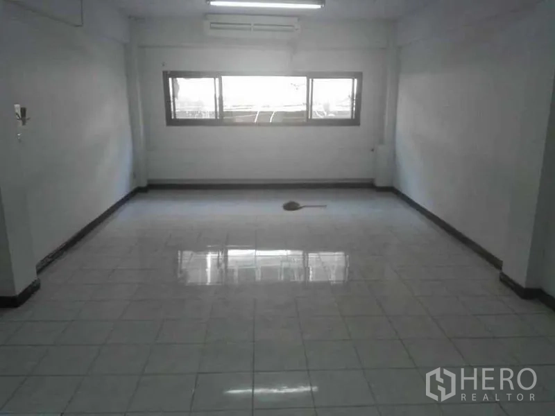 Home Office for rent or sale in Bang Na, Bangkok - Upper-floor office room with white tiles, AC and horizontal windows.