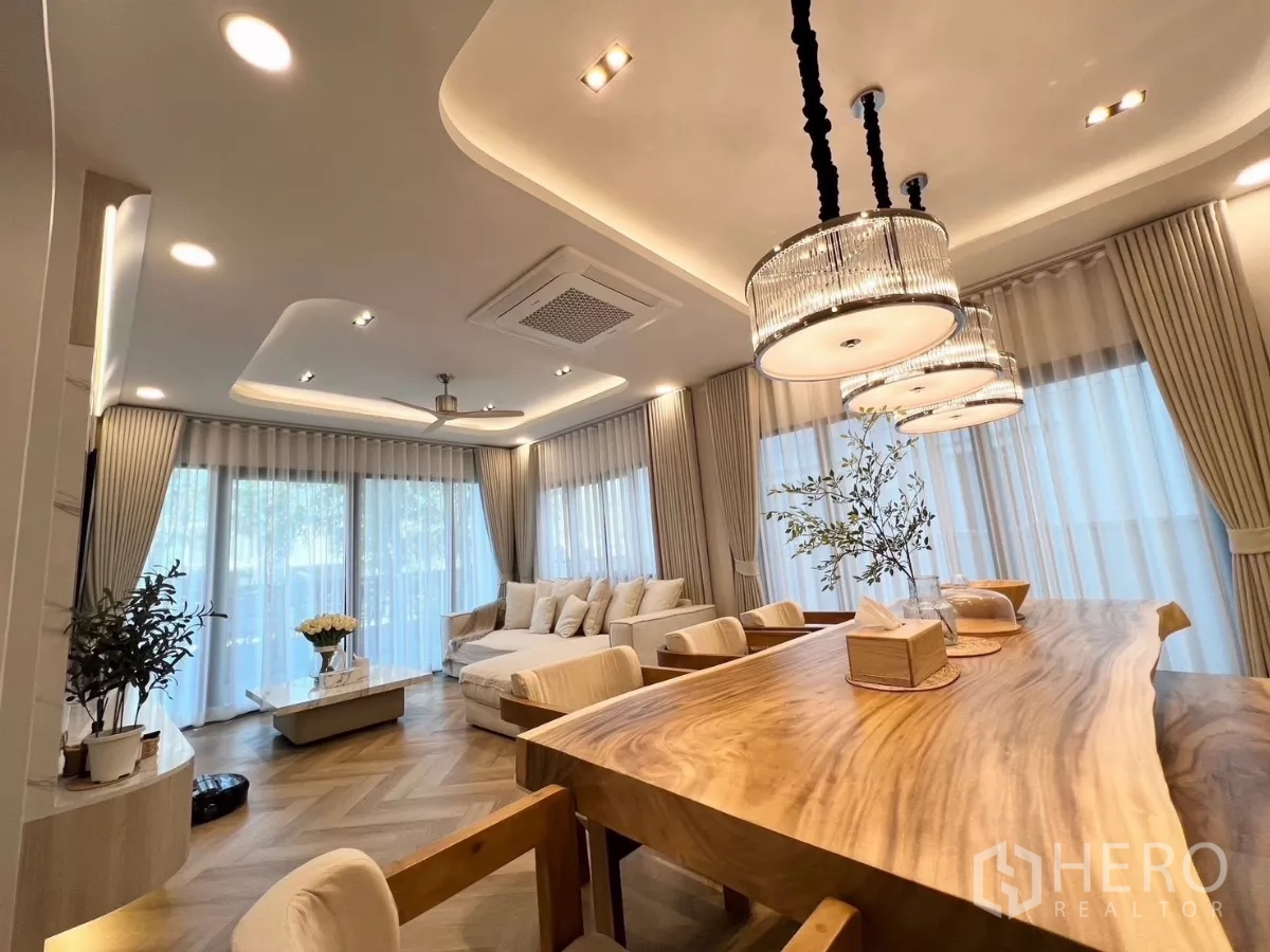 Detached House for rent in Bang Phli, Samut Prakan - Bright lounge and dining space with floor-to-ceiling windows and trio of pendant lights.