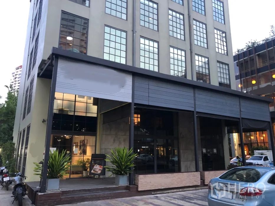Retail Space for rent in Khlong Toei, Bangkok - Modern commercial building with large grid windows, covered terrace, and car access in Thonglor.