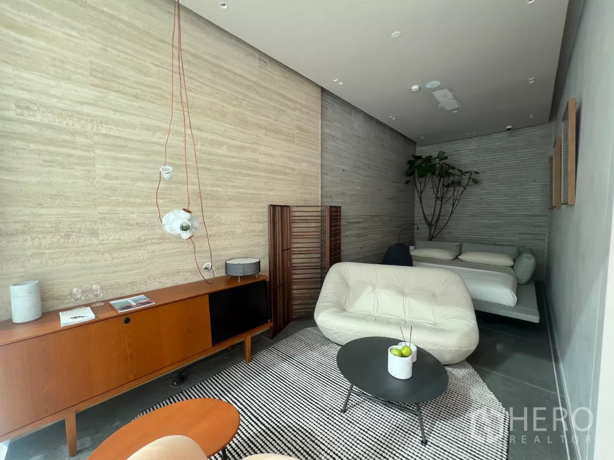 Retail Space for rent - Stylish display room with wood console, pendant lights and daybed.