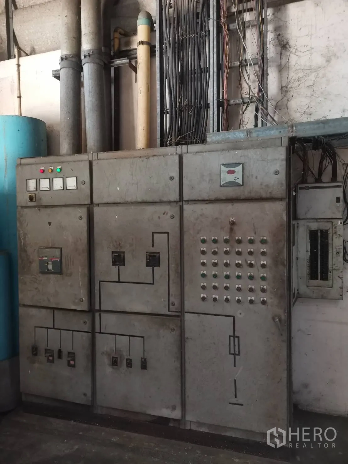 Factory for rent or sale in Bang Khun Thian, Bangkok - Heavy-duty electrical control panel with cable conduits inside the plant.