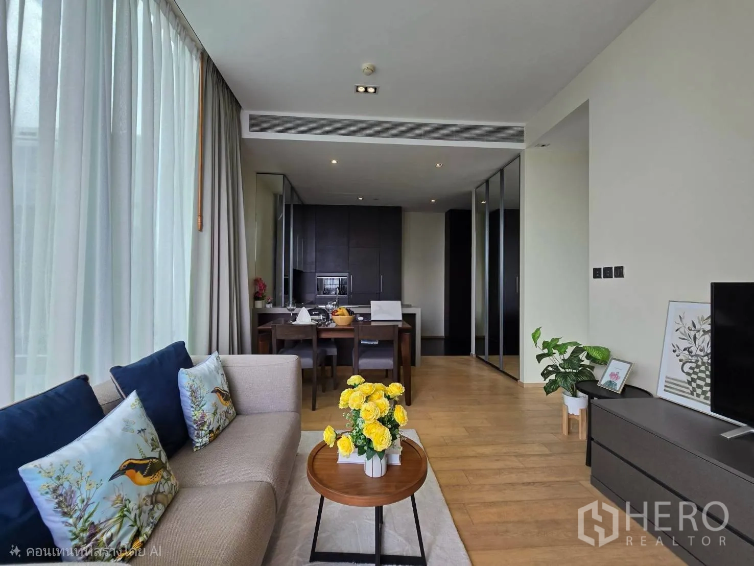 Condominium for rent in Pathum Wan, Bangkok - Cozy living room with sofa, TV console, wood floors, and curtain wall glazing.