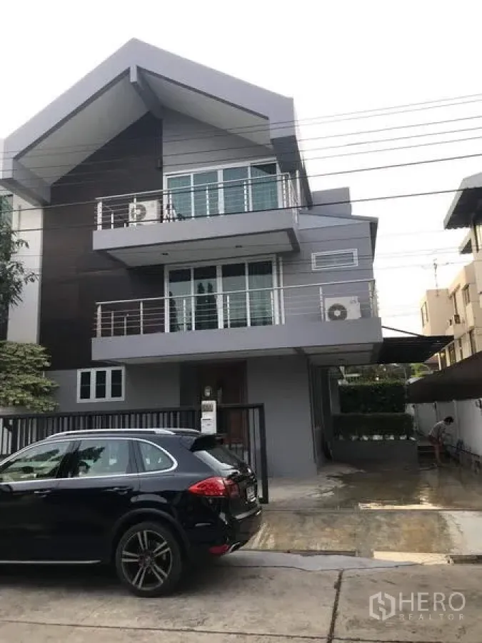 Detached House for rent or sale in Khan Na Yao, Bangkok - Modern three-storey detached house with balconies and a gated driveway