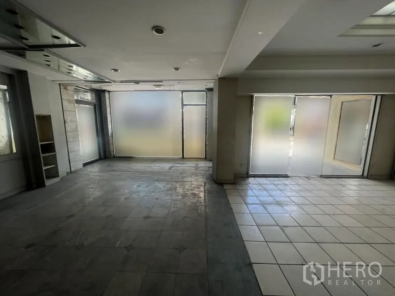 Retail Space for rent in Watthana, Bangkok - Bright shop interior featuring frosted storefront windows and dual entrances.