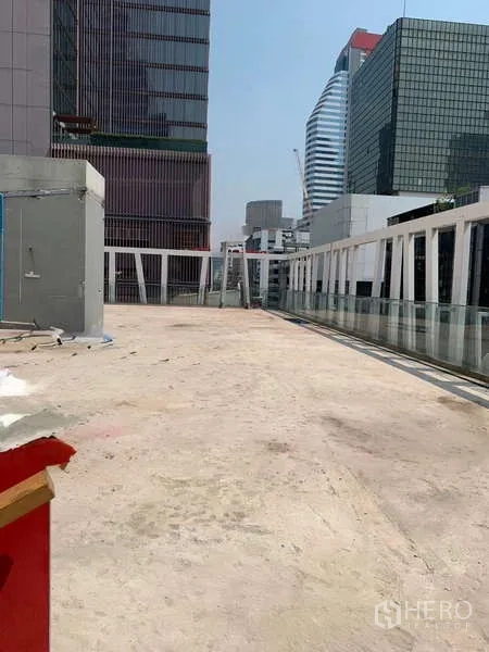 Retail Space for rent in Sathon, Bangkok - Expansive rooftop deck with glass balustrade and Sathon skyline views