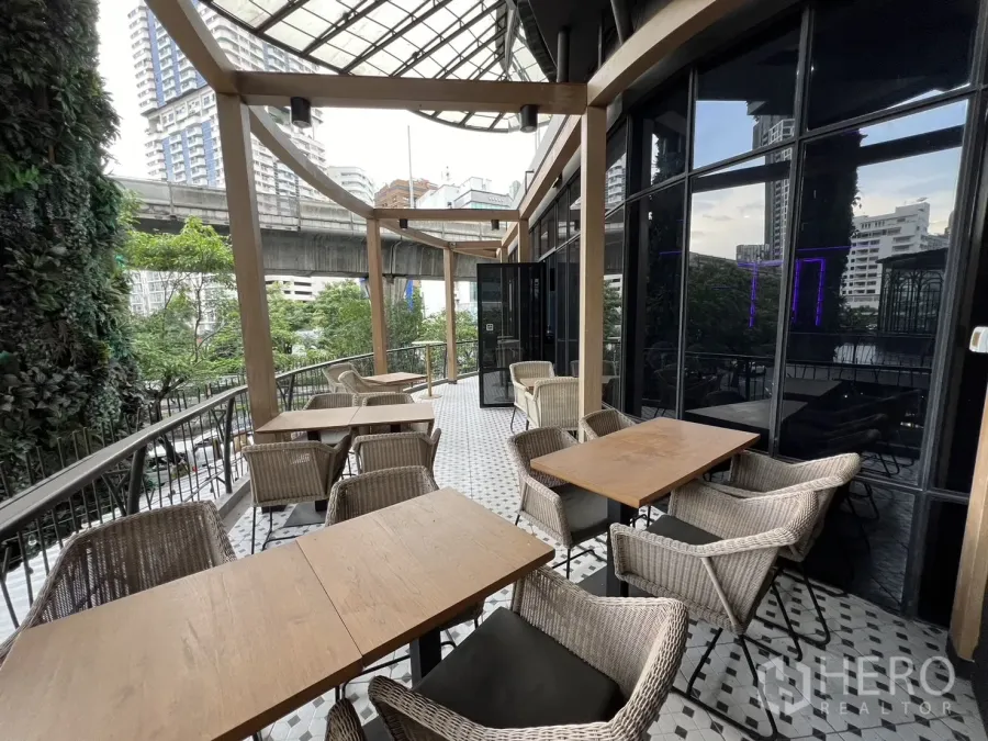 Retail Space for rent - Outdoor dining terrace facing city views and the elevated rail line.