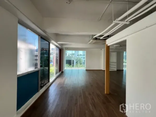Retail Space for rent in Watthana, Bangkok - Long retail hall with floor-to-ceiling windows and city views.