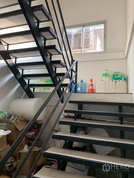 Warehouse for rent in Bang Kapi, Bangkok - Internal metal staircase with handrails leading to the upper office level.