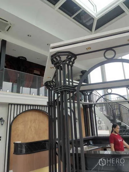 Retail Space for rent - Mezzanine with glass balustrade and skylight above.