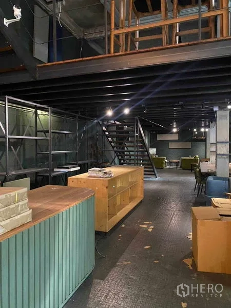 Retail Space for rent in Bang Na, Bangkok - Cafe-style counter with pendant lights and shelving in an industrial setting.