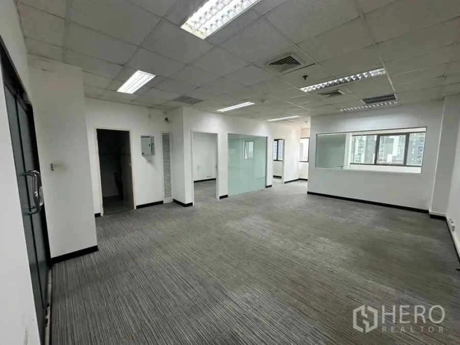 Office Space for rent in Watthana, Bangkok - Open-plan workspace with glass partitions, multiple rooms and plentiful windows.