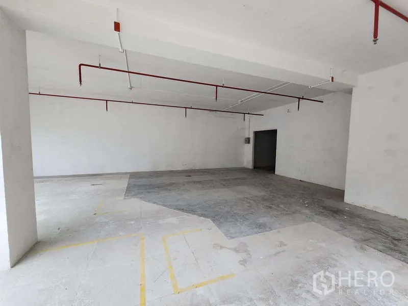 Retail Space for rent in Sathon, Bangkok - Unfinished back-of-house retail area with marked layout lines and sprinkler piping.