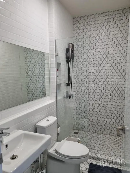 Townhouse for rent - Bathroom from another angle showing walk-in shower and large mirror.