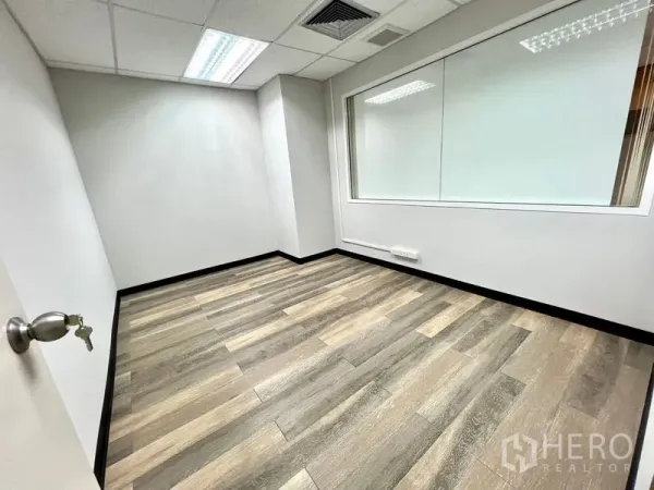 Office Space for rent in Watthana, Bangkok - Compact private office with internal glass window and modern flooring.