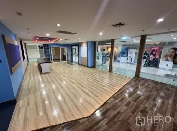 Retail Space for rent in Bang Rak, Bangkok - Spacious open-plan retail area with glass frontage, ceiling spotlights, and polished floors in a mall setting.