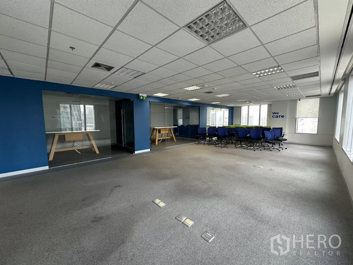 Office Space for rent in Watthana, Bangkok - Training area with rows of office chairs and glass meeting rooms.