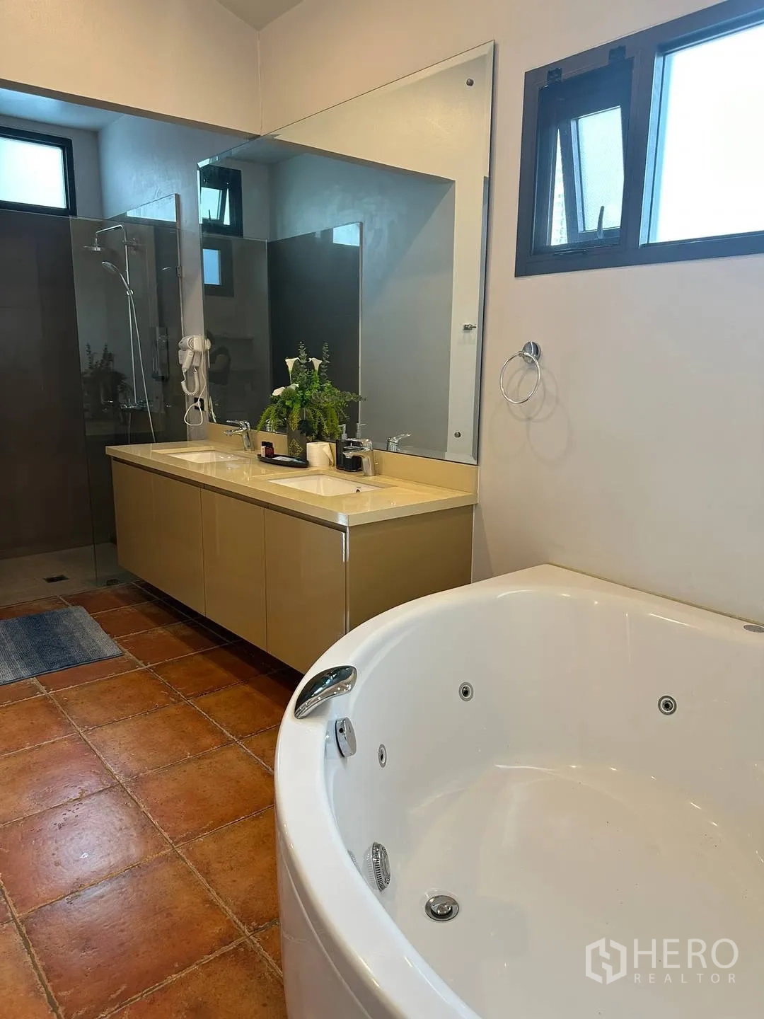 Detached House for rent in Watthana, Bangkok - Bathroom with jacuzzi tub, double vanity and glass shower.