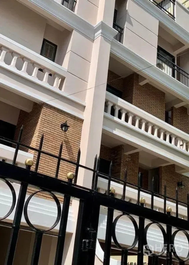 Home Office for rent in Khlong Toei, Bangkok - Multi-storey home office exterior with brick accents and black metal gate in Nana.