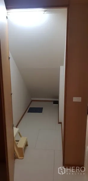 Condominium for rent in Khlong Toei, Bangkok - Under-stair storage room with tiled floor and utility space.