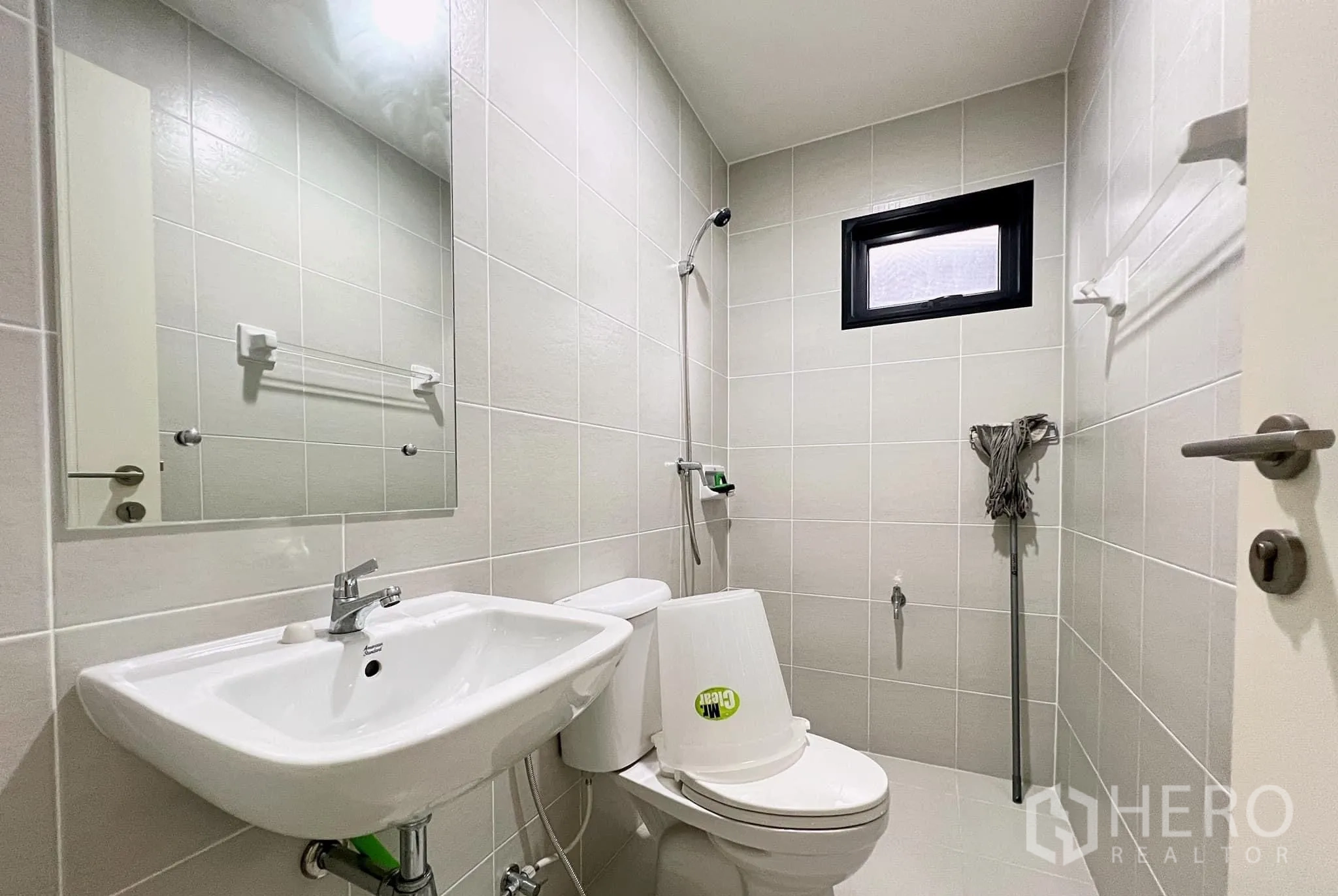 Detached House for rent or sale in Lam Luk Ka, Pathum Thani - Clean bathroom with shower, toilet and wall mirror.