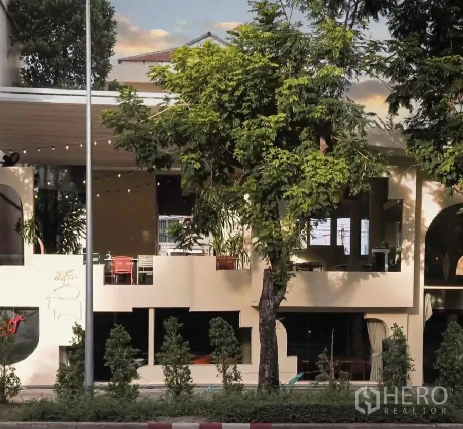 Retail Space for rent in Sathon, Bangkok - Modern two-storey restaurant facade with arched windows, trees and greenery along a main road.