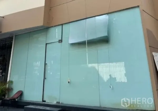 Retail Space for rent in Khlong Toei, Bangkok - Street-level retail storefront with full-height frosted glass and a single glass door.