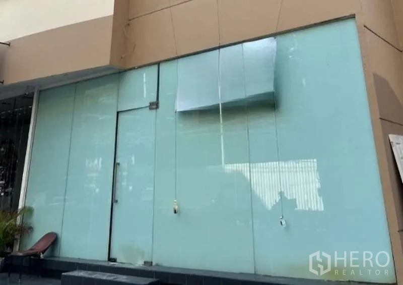 Retail Space for rent in Khlong Toei, Bangkok - Street-level retail storefront with full-height frosted glass and a single glass door.