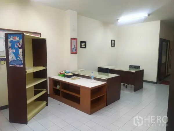 Home Office for rent in Yan Nawa, Bangkok - Open-plan home office with desks, shelving and white tile flooring under fluorescent lights.
