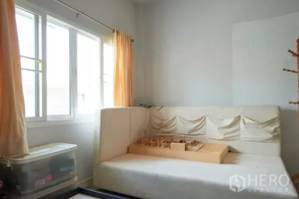 Home Office for rent in Wang Thonglang, Bangkok - Cozy lounge or studio corner with large window and built-in daybed.