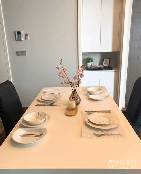 Detached House for rent in Prawet, Bangkok - Minimalist dining table set for four in a modern home.