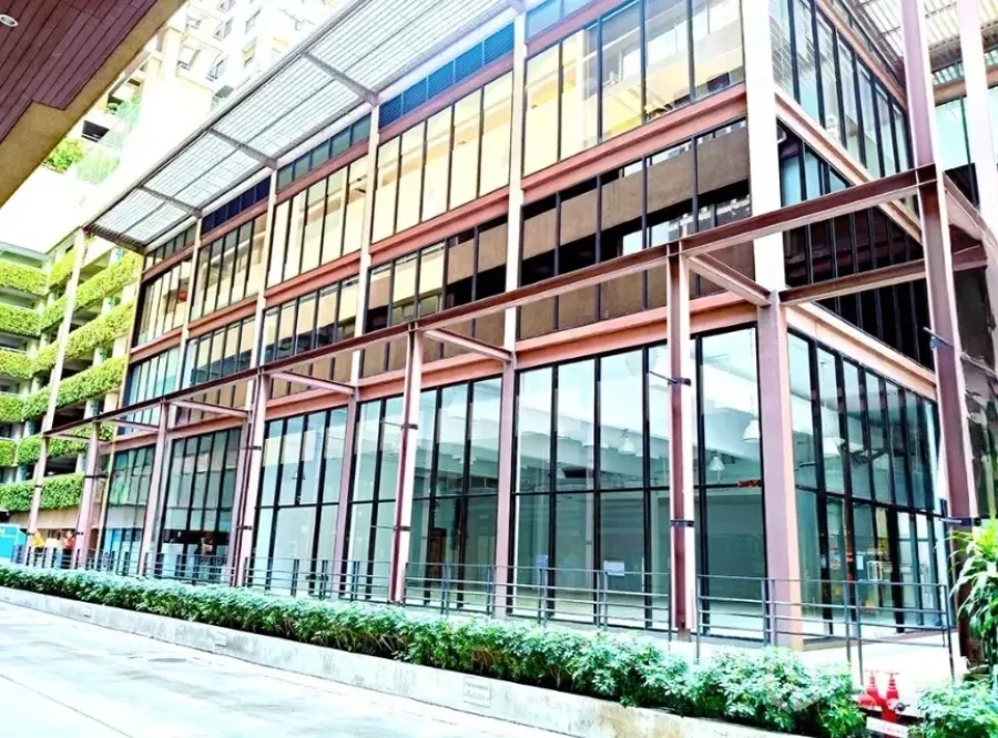 Office Space for rent in Watthana, Bangkok - Modern low-rise office building with floor-to-ceiling glass facade and covered walkway in Watthana.