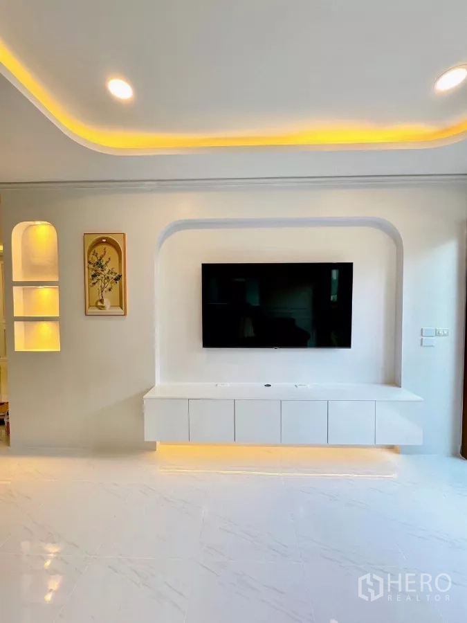 Detached House for rent in Bang Phli, Samut Prakan - Built-in TV wall with floating cabinet and illuminated display niches.