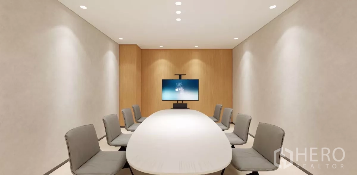Office Space for rent in Huai Khwang, Bangkok - Enclosed meeting room with oval table, eight chairs and a wall-mounted presentation screen.