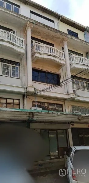 Home Office for rent or sale in Bang Na, Bangkok - Four-storey shophouse-style exterior with balconies and columns in Bang Na.