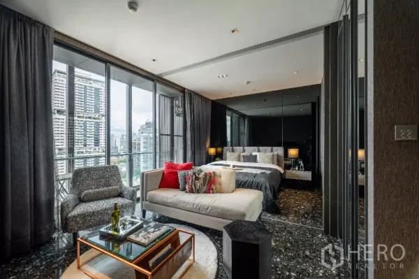 Condominium for rent or sale in Khlong Toei, Bangkok - Stylish bedroom and lounge with floor-to-ceiling windows and Bangkok skyline view.