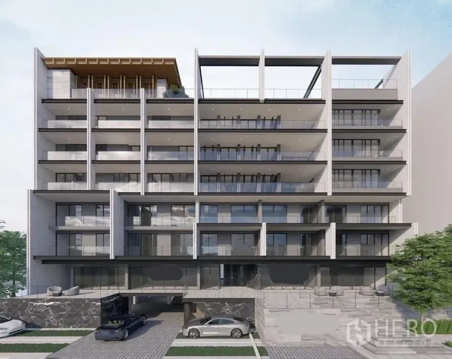 Retail Space for rent in Watthana, Bangkok - Contemporary mid-rise building with glass balconies, ground-floor retail frontage and a covered driveway in Bangkok.