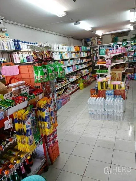 Retail Space for rent in Bang Na, Bangkok - Compact retail space showing product racks, bottled water display and fluorescent lighting for an easy-to-browse layout.