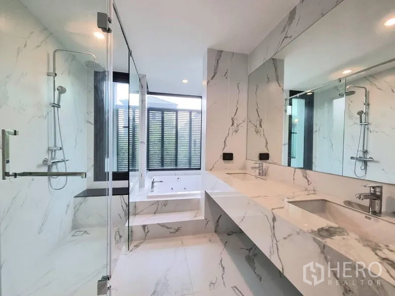 Detached House for rent - Spacious marble bathroom with double vanity, glass shower, and soaking tub.