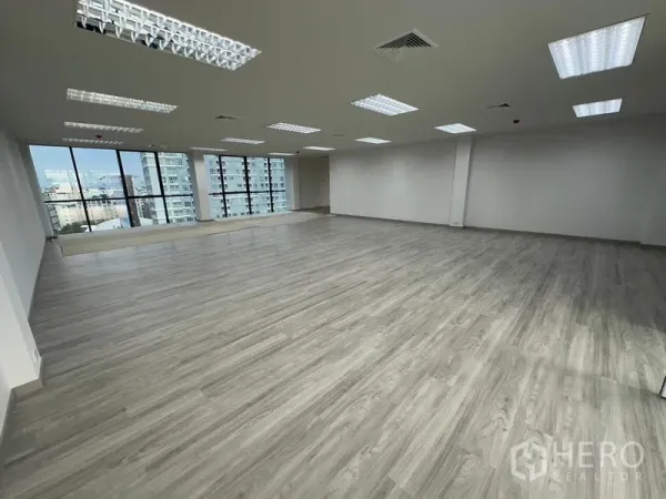 Office Space for rent - Bright open workspace with wide windows, natural light and views of downtown Bangkok.