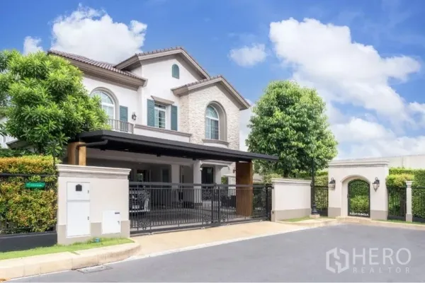 Detached House for rent in Bang Khen, Bangkok - Two-storey detached house with stone facade, gated driveway and covered carport in Bang Khen.