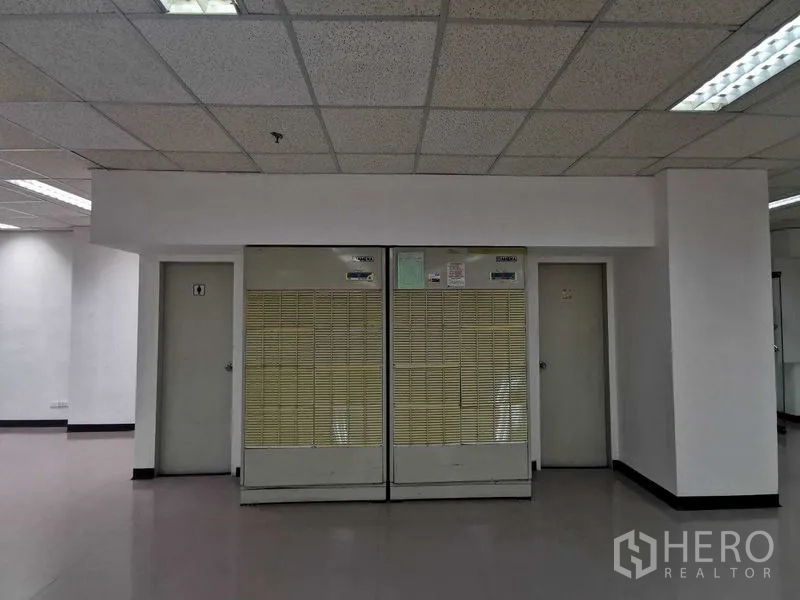 Office Space for rent in Watthana, Bangkok - Server or utility room doors with built-in air-conditioning units within the office interior.