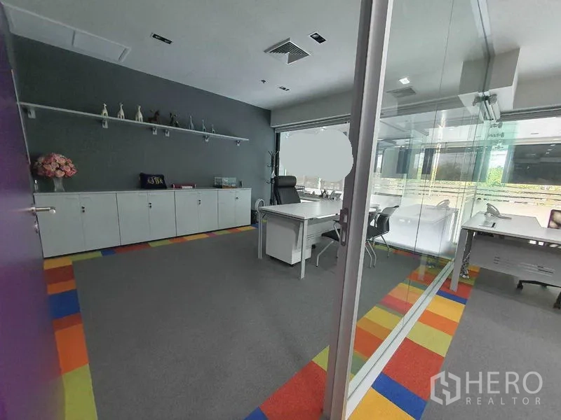 Office Space for rent in Ratchathewi, Bangkok - Executive office with long storage cabinets, display shelf, and glass partition.