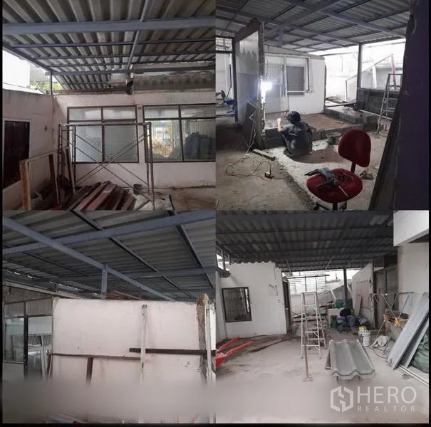 Home Office for rent in Suan Luang, Bangkok - Work zone showing steel framing, corrugated roofing and partition walls being installed around windows.