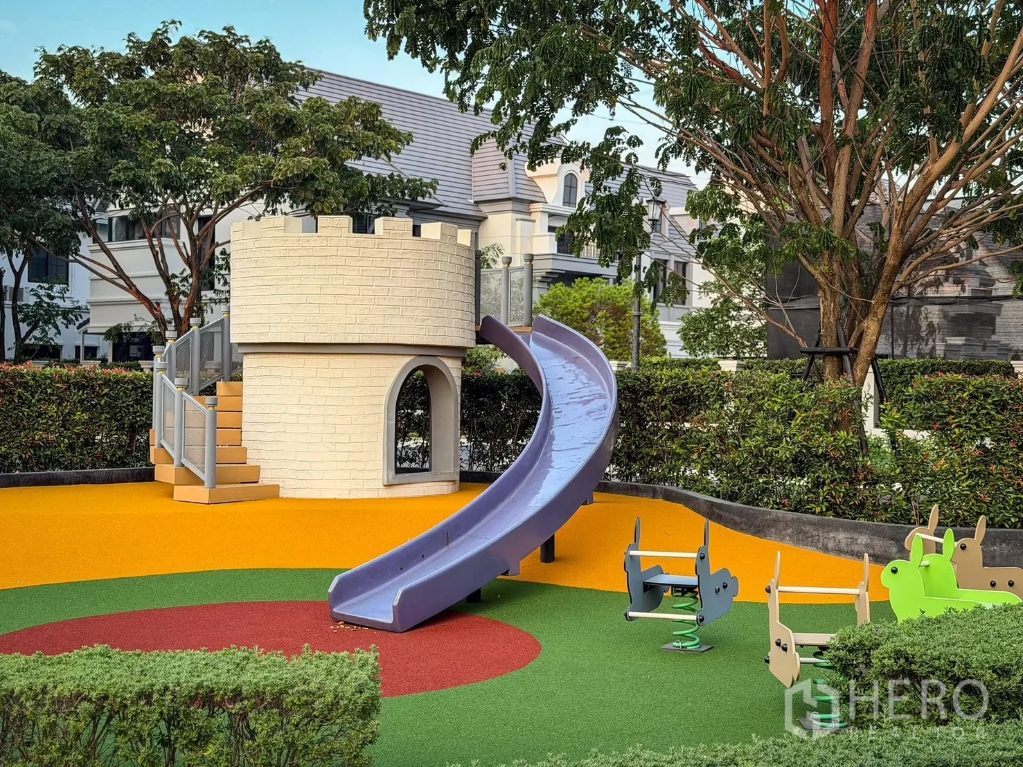 Detached House for rent in Bang Khen, Bangkok - Children’s playground with castle-style slide, colorful rubber flooring and mature trees.