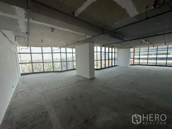 Office Space for rent - Corner office area with panoramic windows delivering abundant natural light over the Ekkamai district.