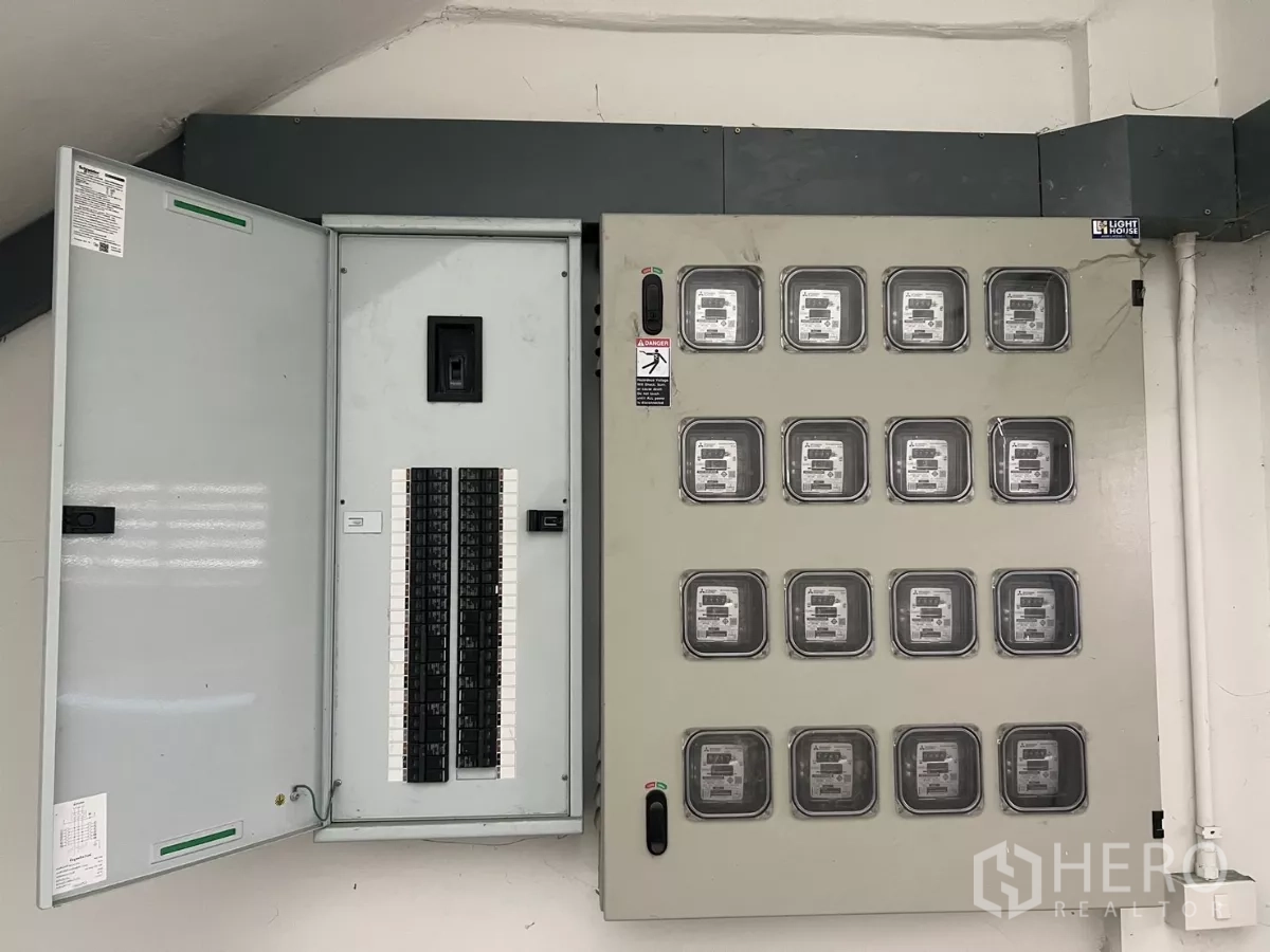 Warehouse for rent or sale in Lat Krabang, Bangkok - Electrical control room with a breaker panel and multiple power meters.